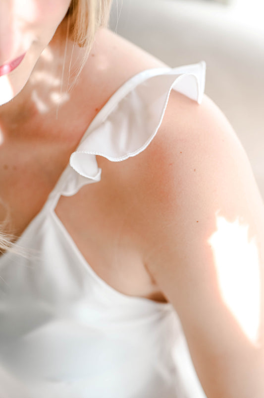 Bridal silk getting ready pajamas for the wedding morning. With beautiful frills on the shoulder and shorts