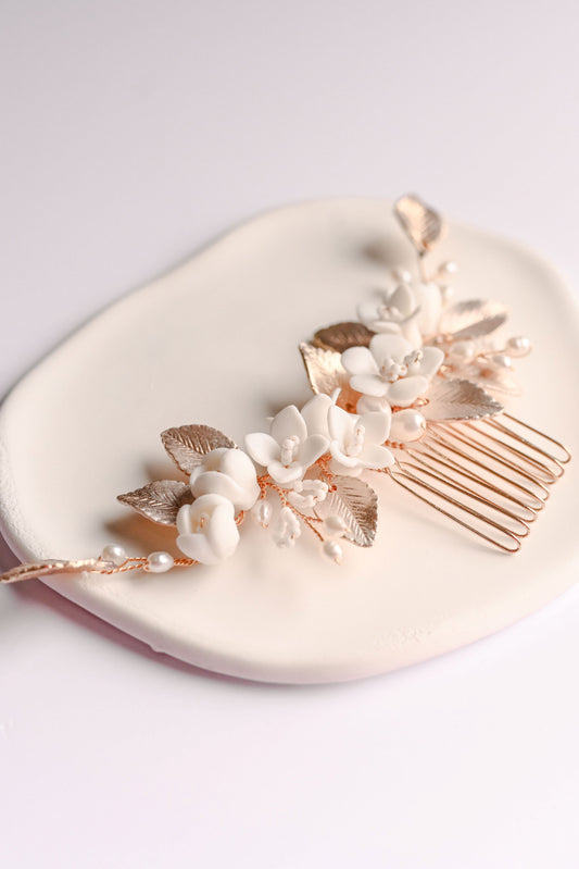 Rose gold bridal hair comb with porcelain flowers, fresh water pearls and leaf details.