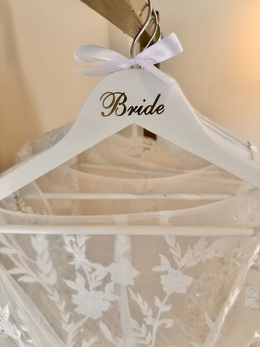White hanger with rose gold bride letters and ribbon bow