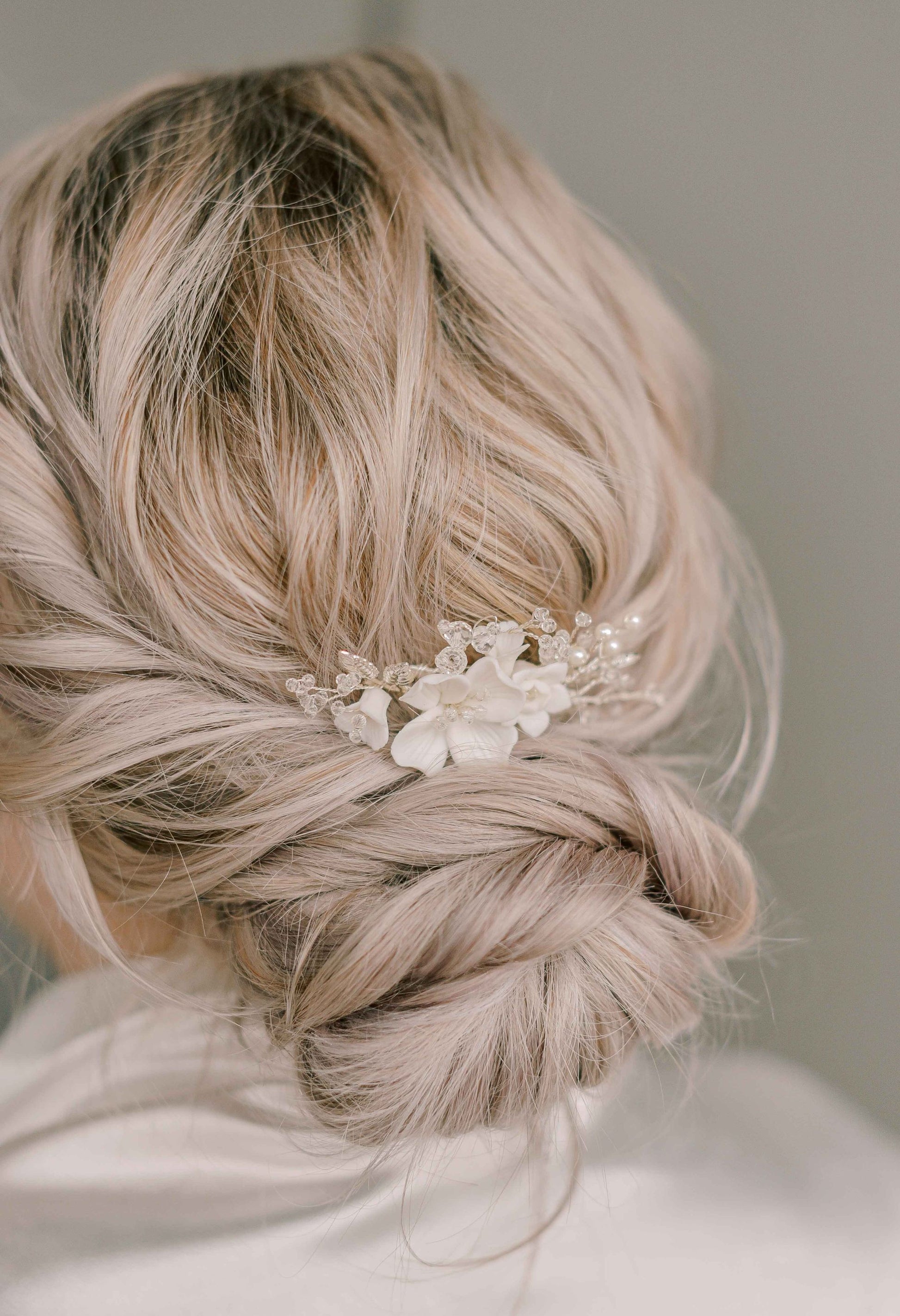 Bride wearing porcelain flower hair comb