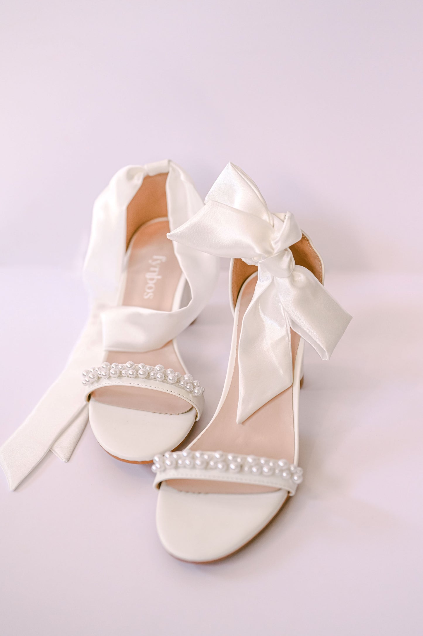Bridal block heel with a satin bow strap and pearl toe strap