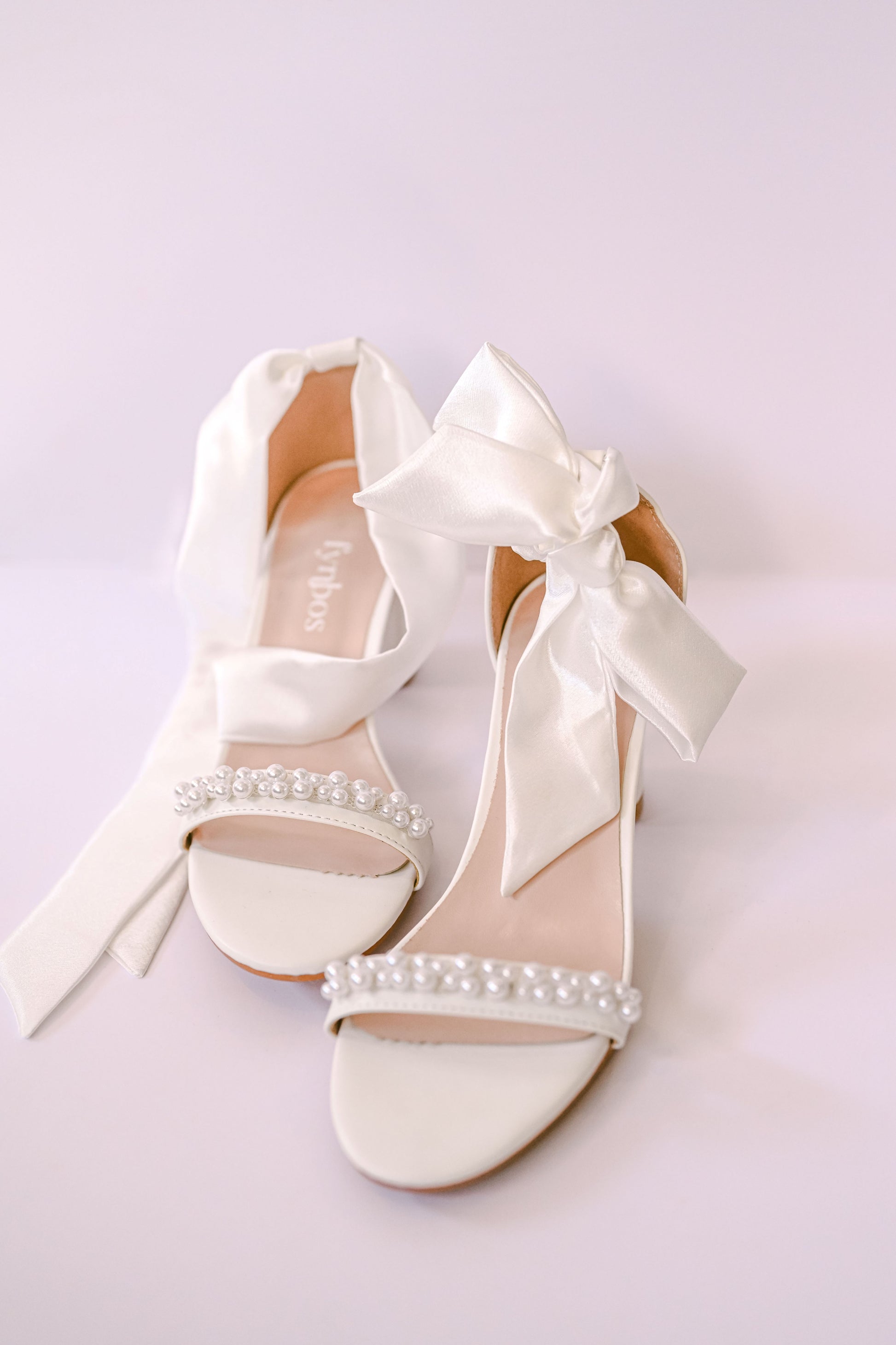Bridal block heel with a satin bow strap and pearl toe strap
