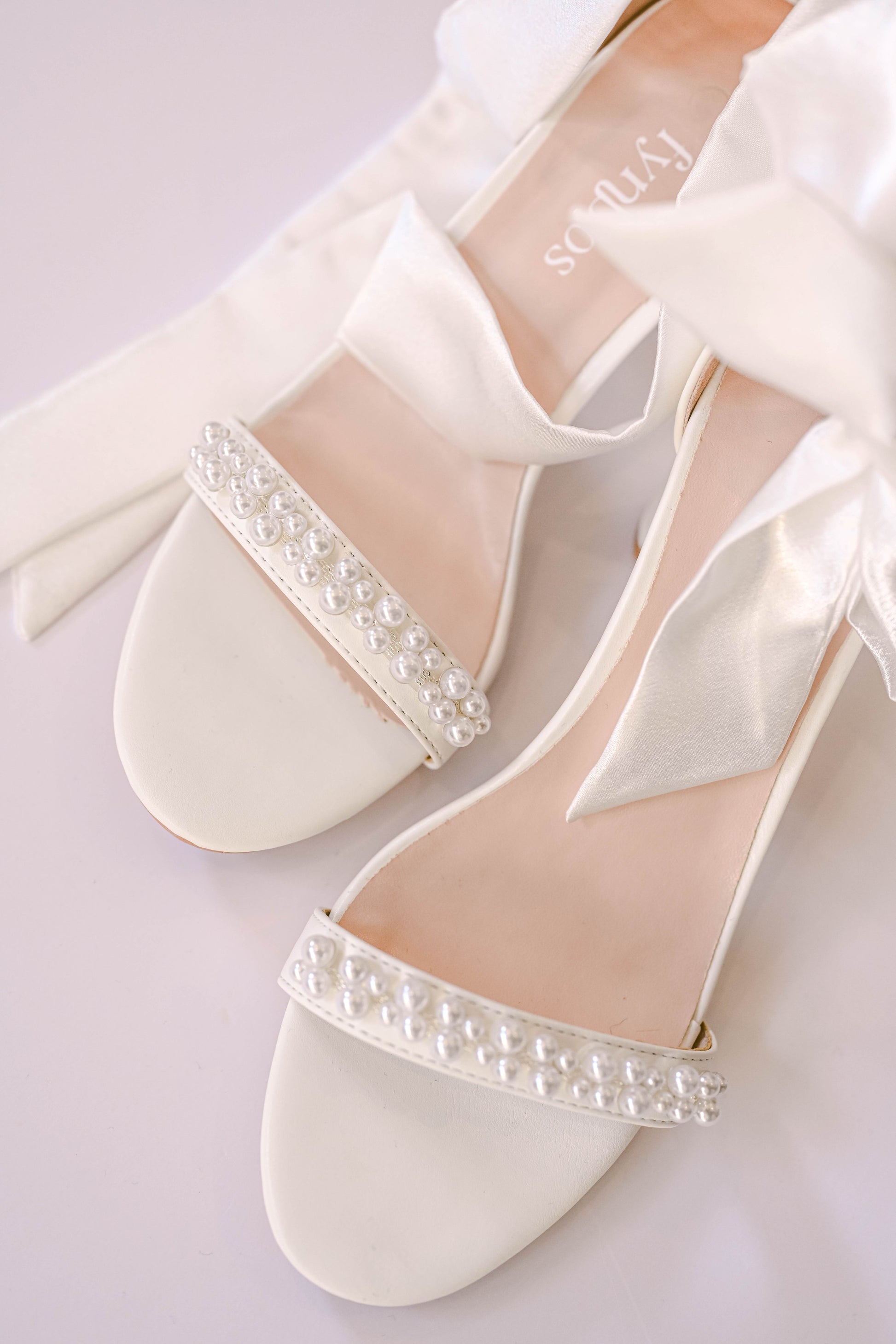 Bridal  ivory block heel with a satin bow strap and pearl toe strap
