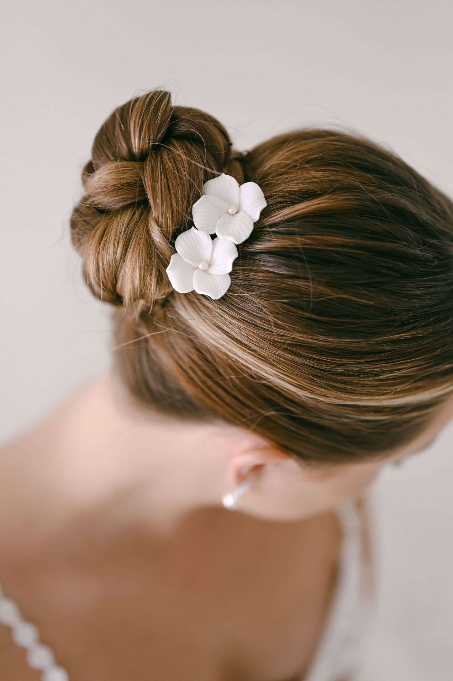 Bride wearing porcelain flower hair clip