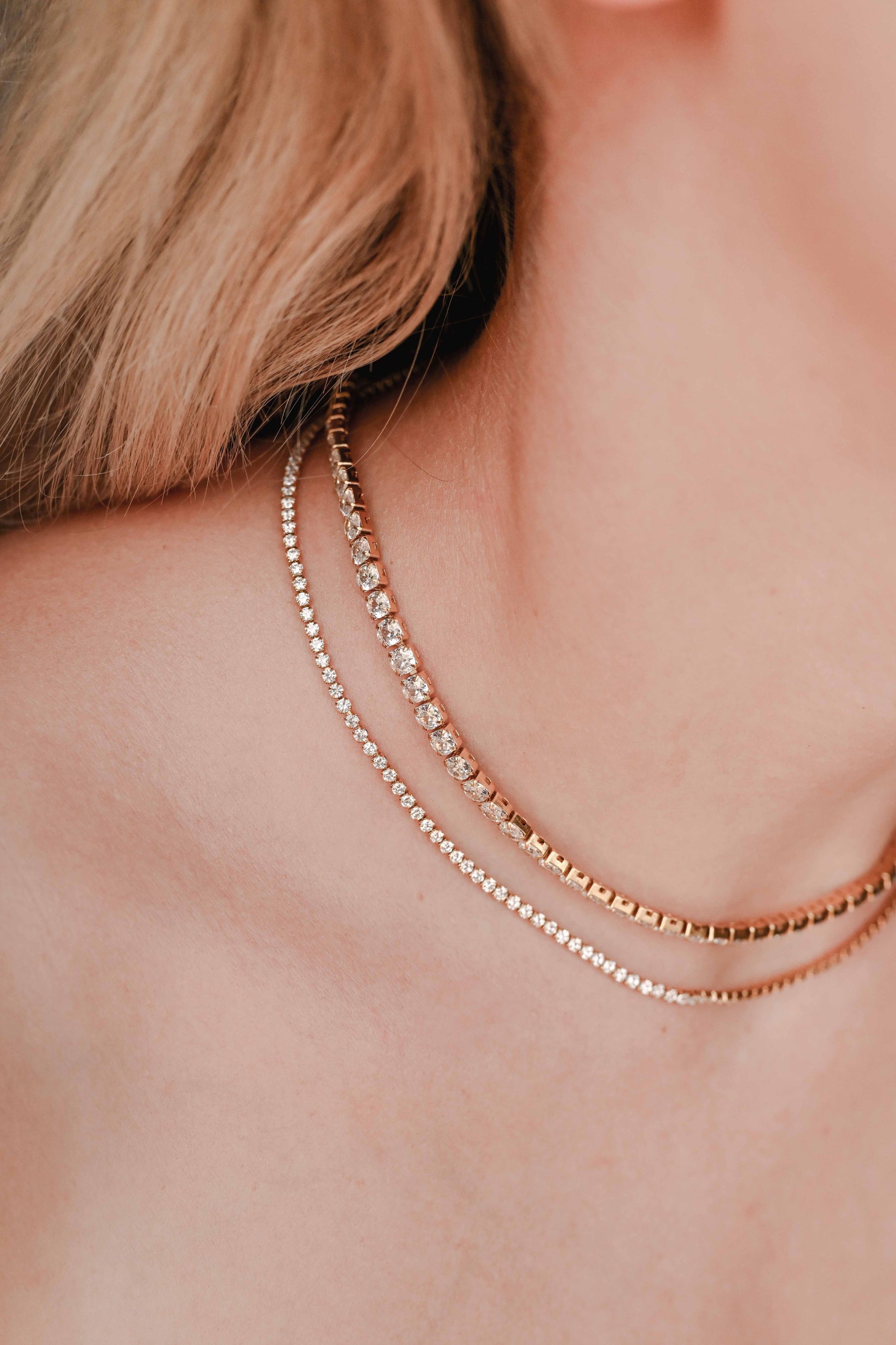 Bride wearing stainless steel, 18K gold PVD plated necklace with cubic zirconia. Water and tarnish proof.