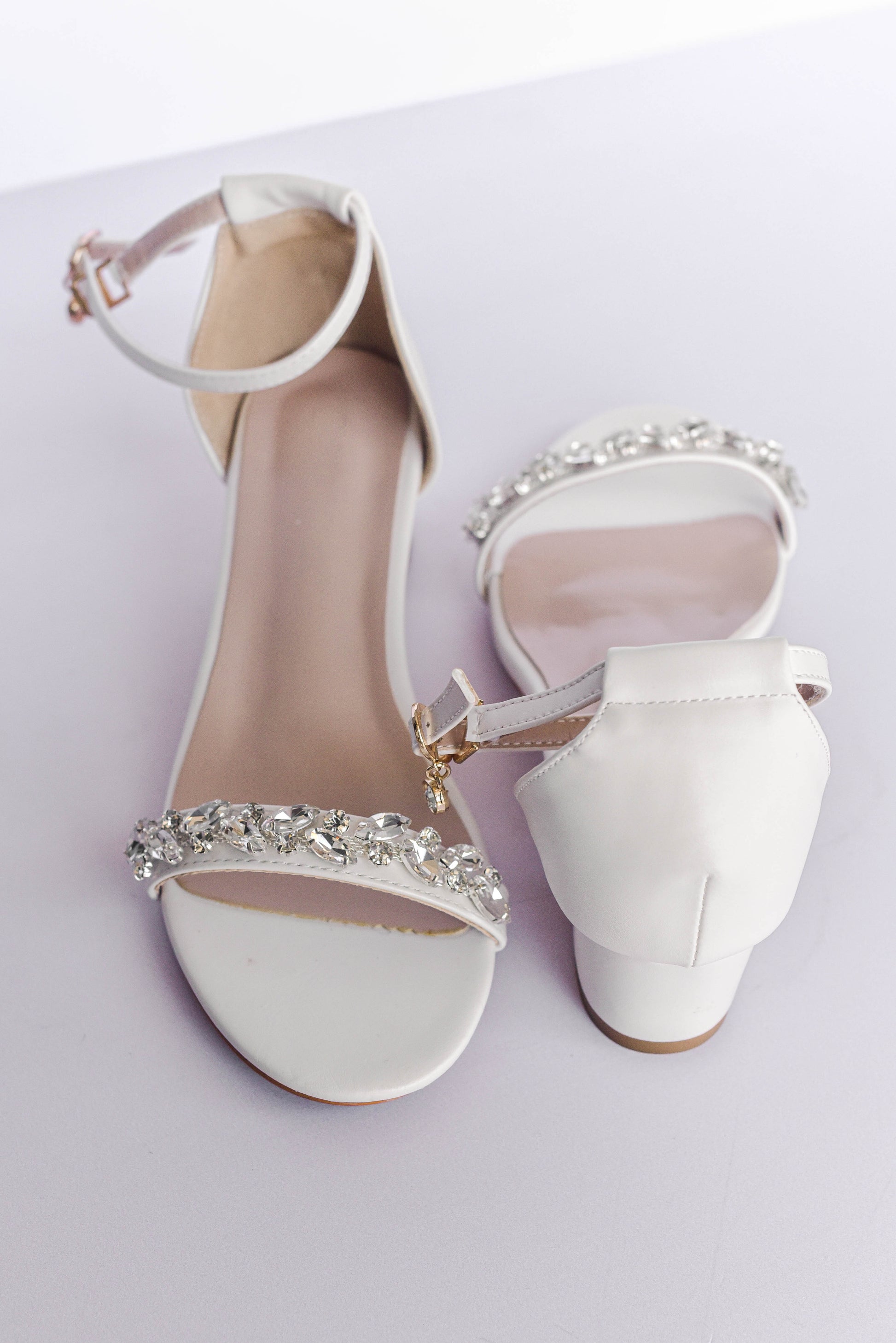 Ivory bridal block heel with rhinestone embellishments on toe strap