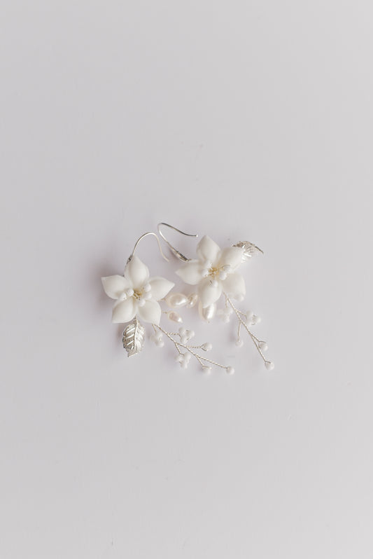Pair of silver bridal earrings with porcelain flowers, fresh water pearls and beads