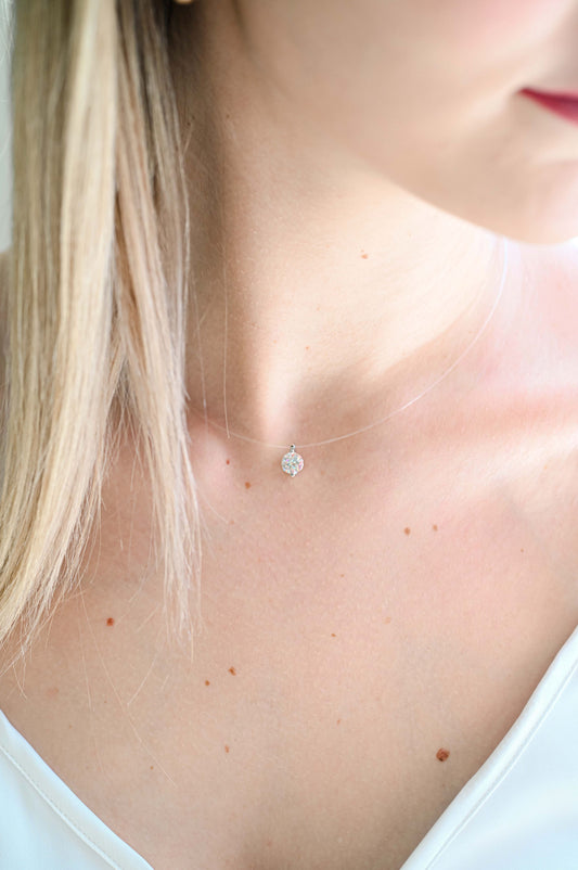 Bride wearing floating moissanite necklace