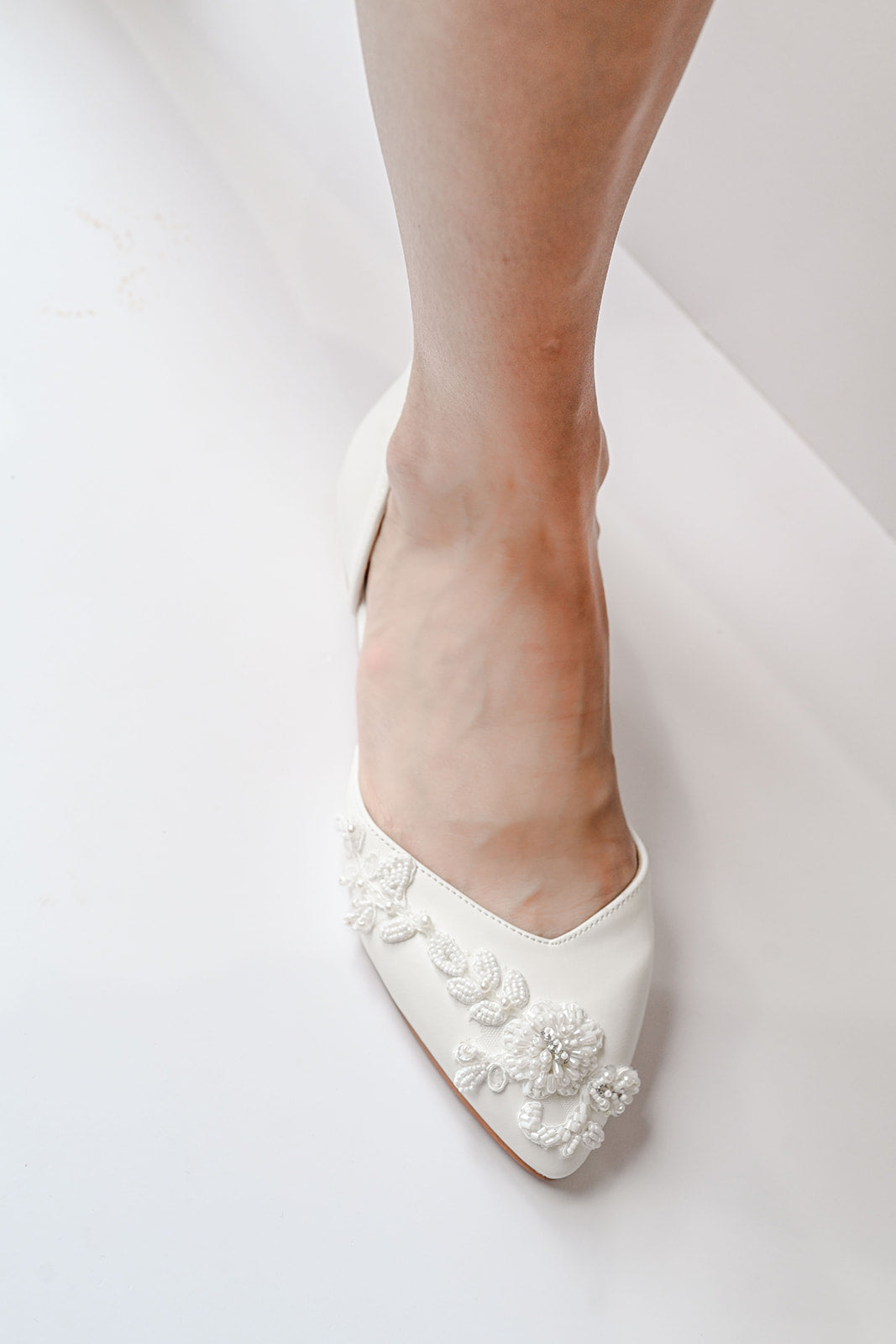 Ivory bridal flats with beaded lace decoration