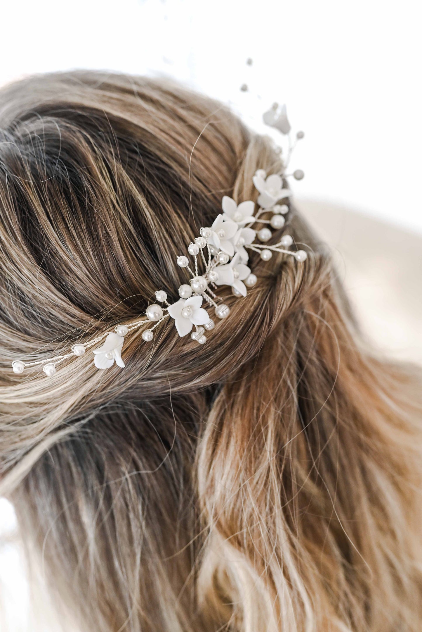 Bridal hair comb with porcelain flowers and faux pearls.