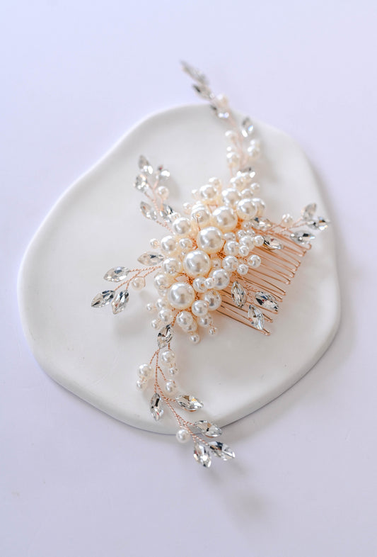 Gold bridal hair comb with pearls and rhinestones.
