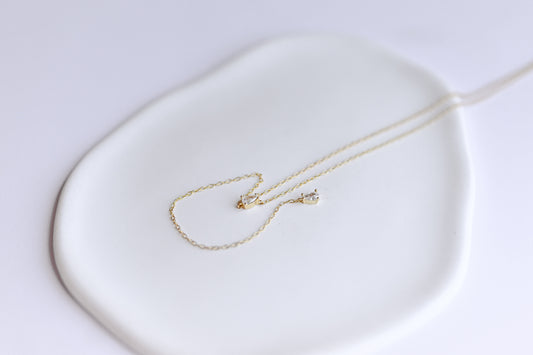 S925 sterling silver, gold plated lariat necklace with two teardrop Cubic Zirconia.