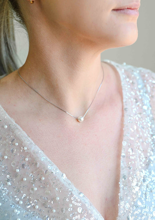 Bride wearing a sterling silver collier pearl necklace