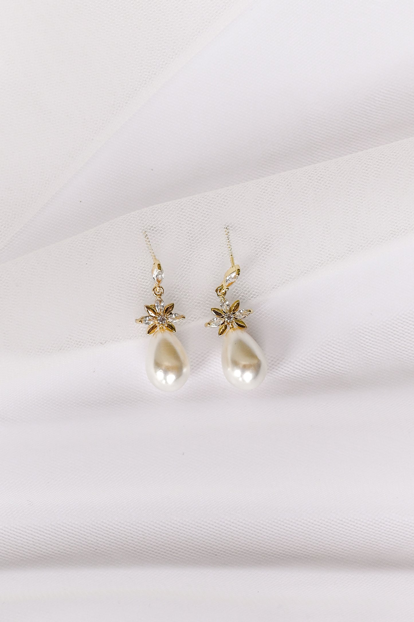 Gold bridal earrings with cubic zirconia and a faux pearl