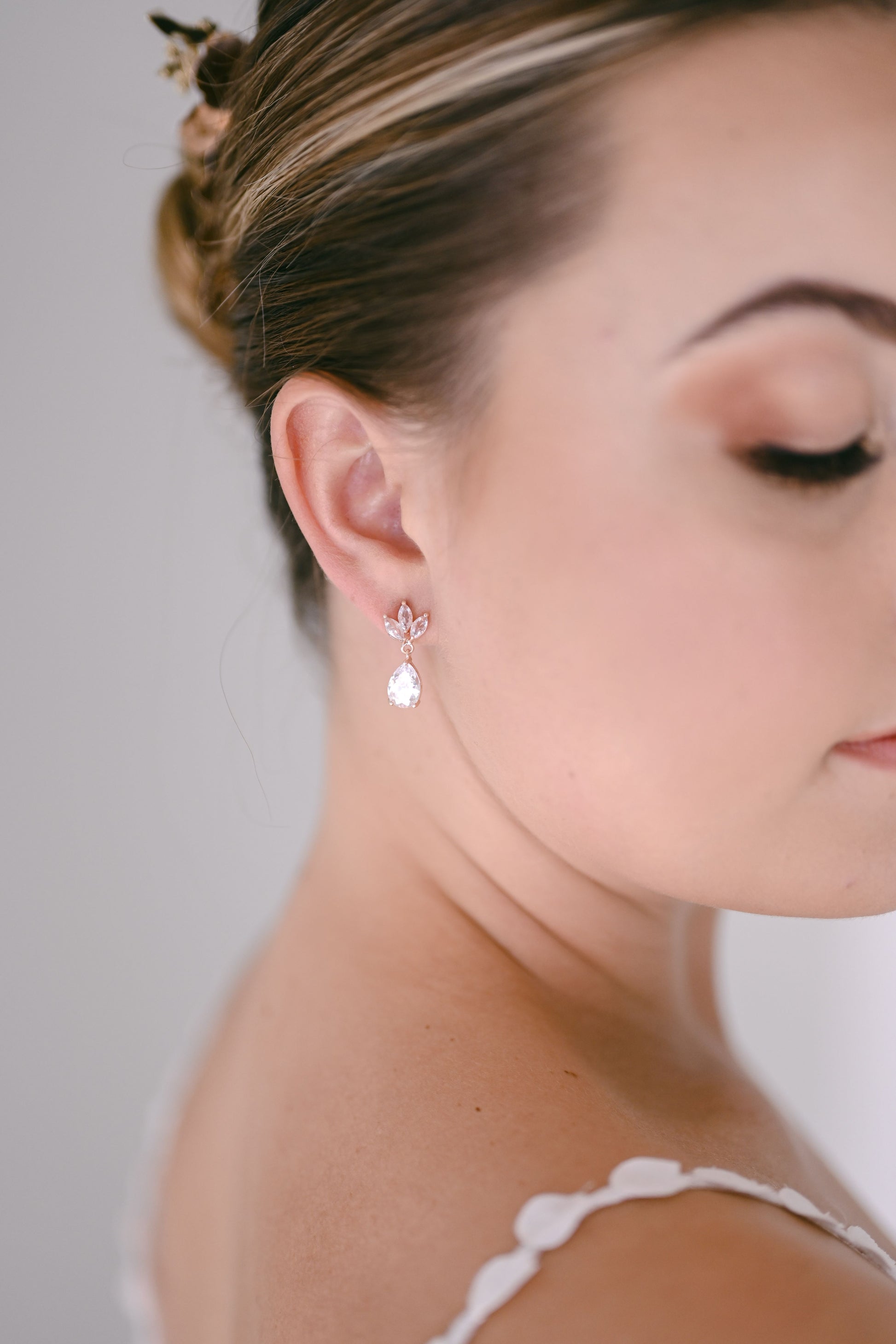 Bride wearing dainty cubic zirconia bridal drop earring
