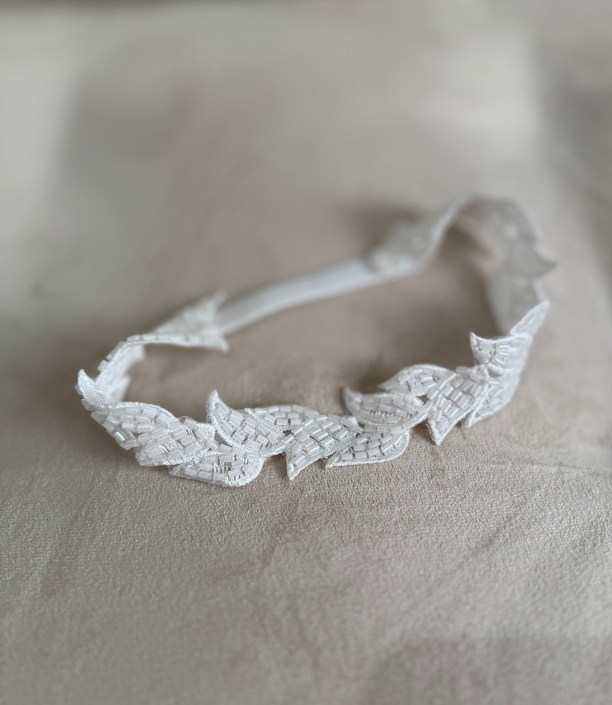 Bridal garter with beaded lace leaf design