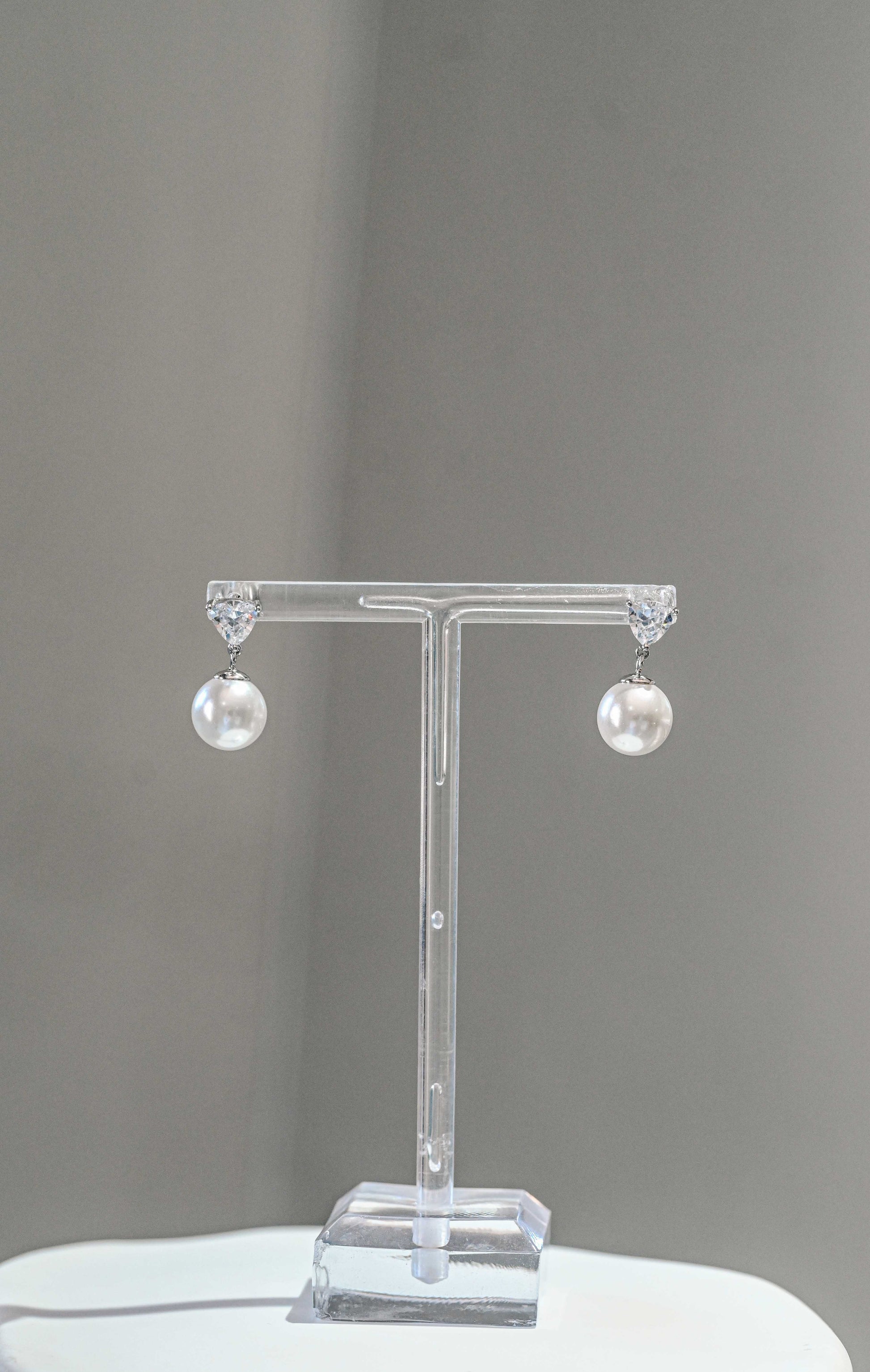 Sterling cubic zirconia earring with a drop pearl