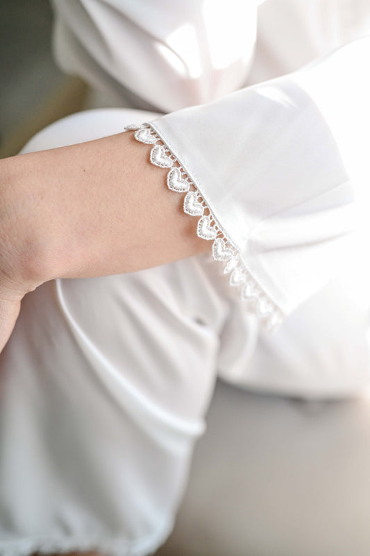 Bridal silk long sleeve getting ready set for the bride. Heart detail on trim.