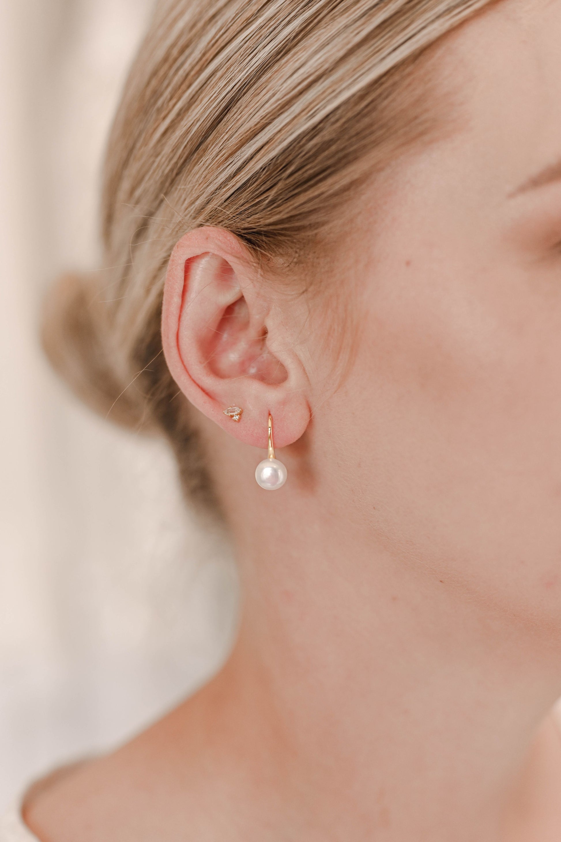 Bride wearing S925 sterling silver and gold plated drop earring with pearl.