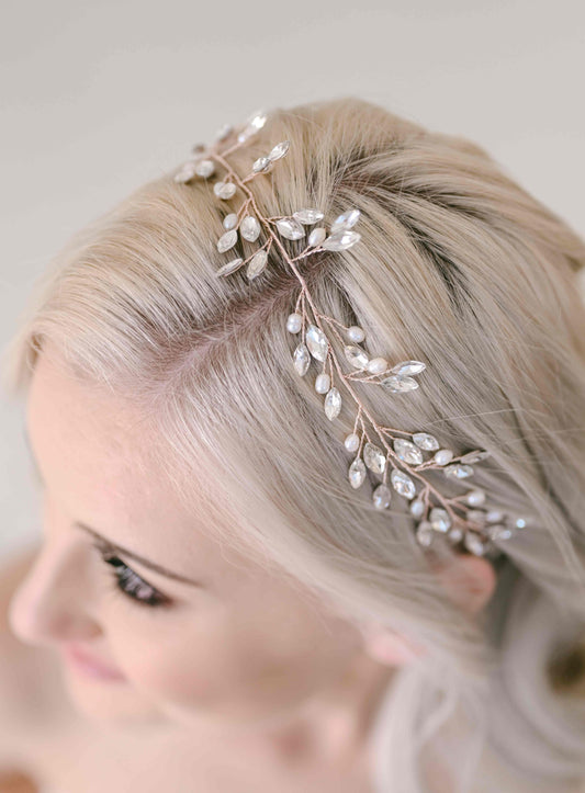 Bride wearing a rhinestone and fresh water pearls hair vine