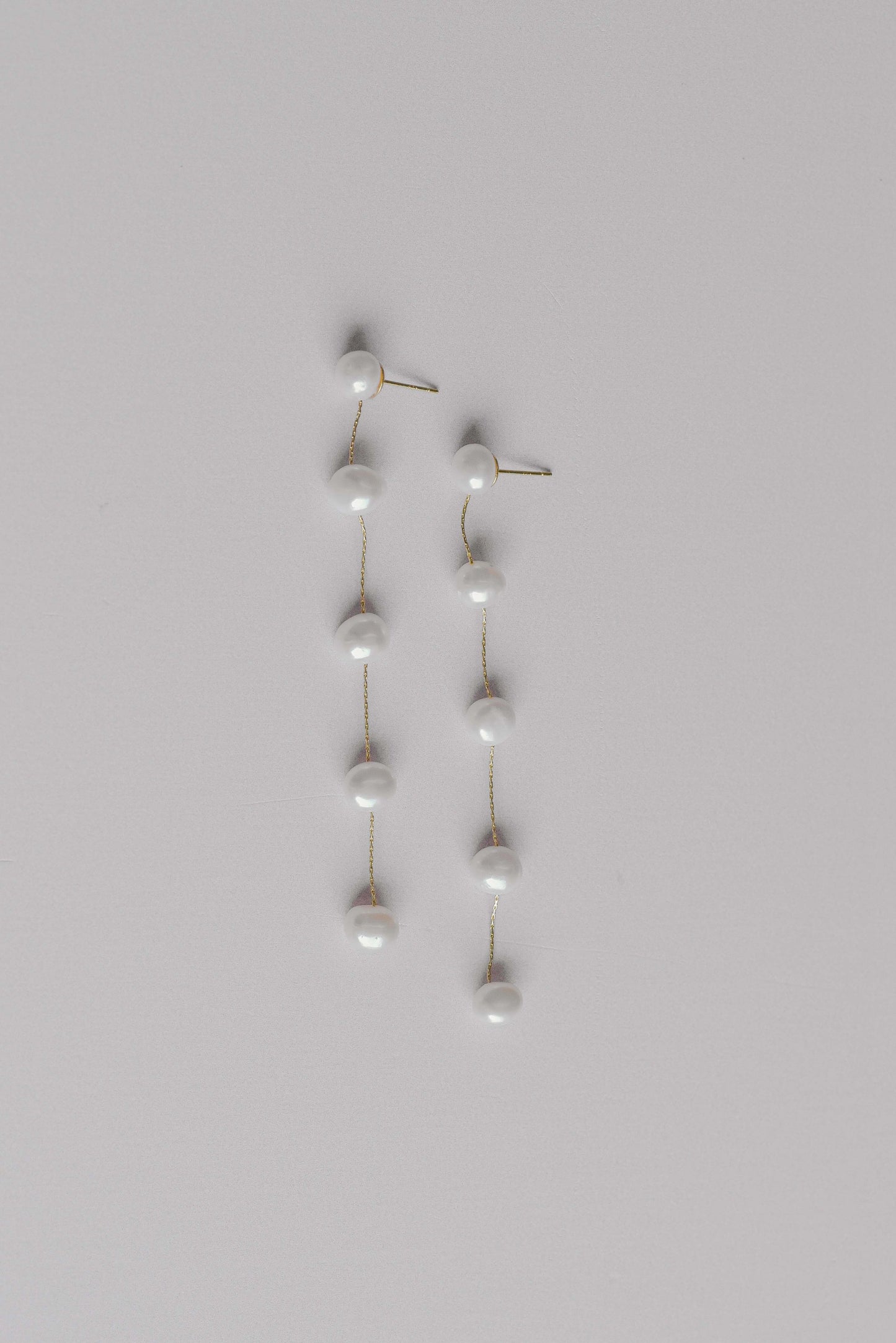 Gold string of 5 fresh water pearl earrings