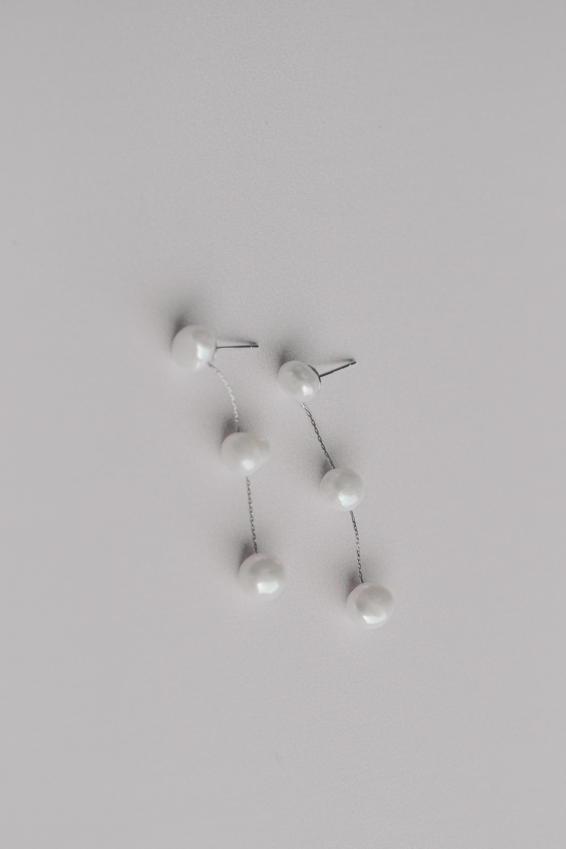 Silver bridal earrings with a string of 3 fresh water pearls
