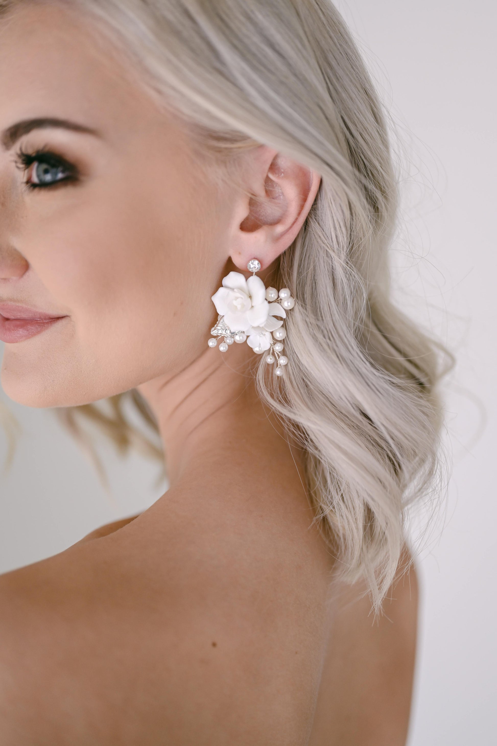 Bride wearing porcelain rose earrings
