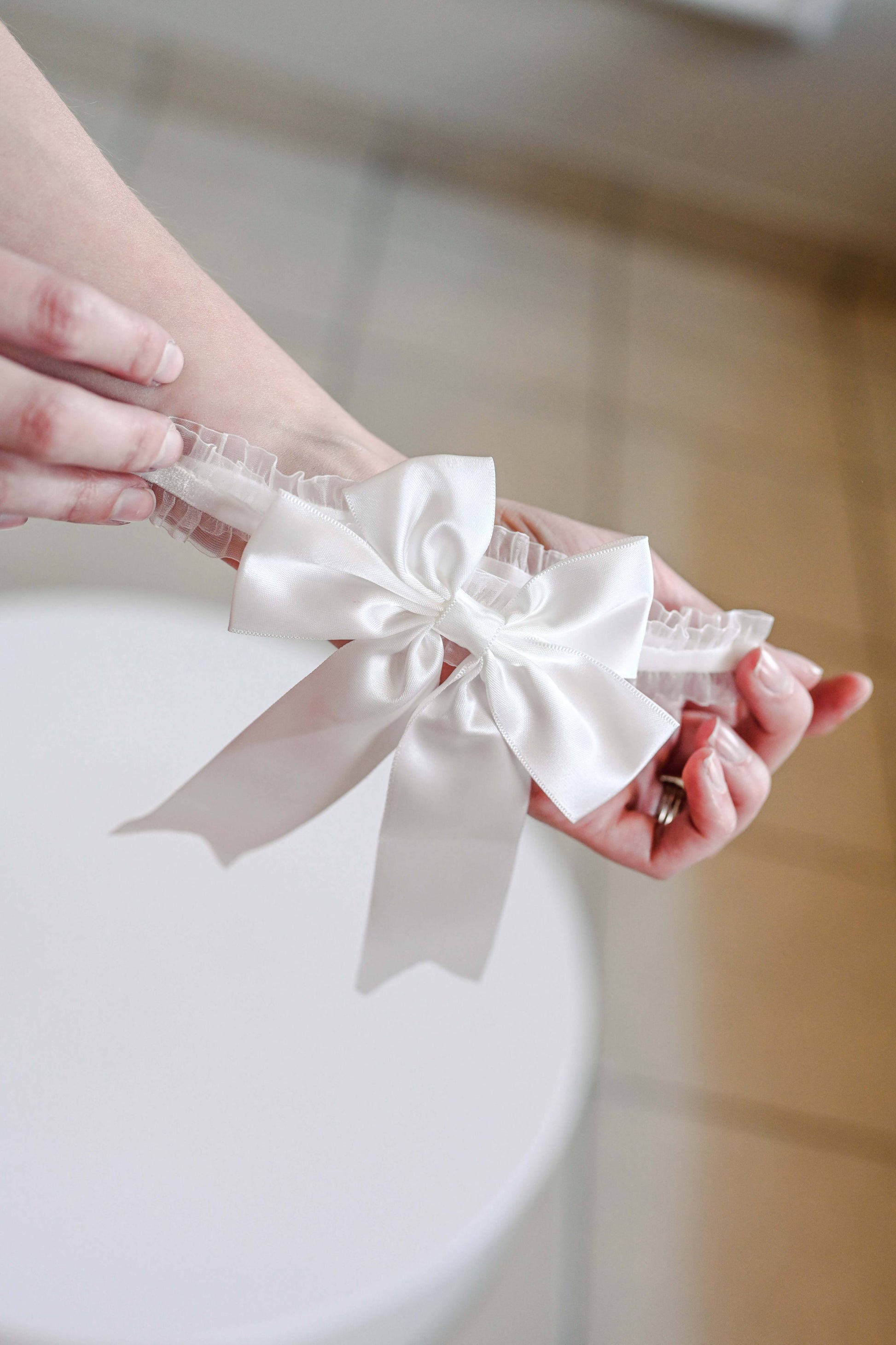 Satin bow bridal garter with elastic band