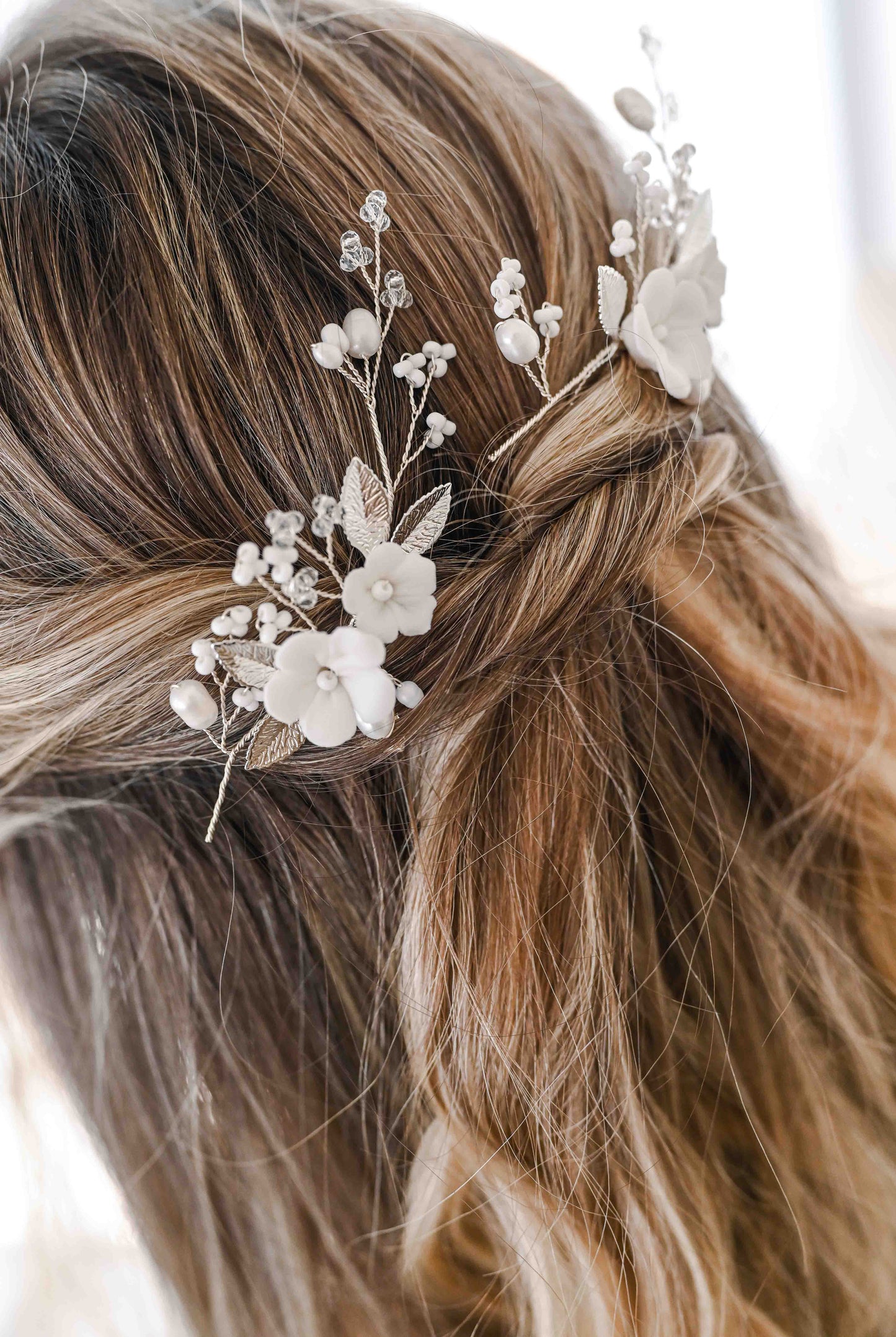 Set of two porcelain flower bridal hair pins with freshwater pearls.