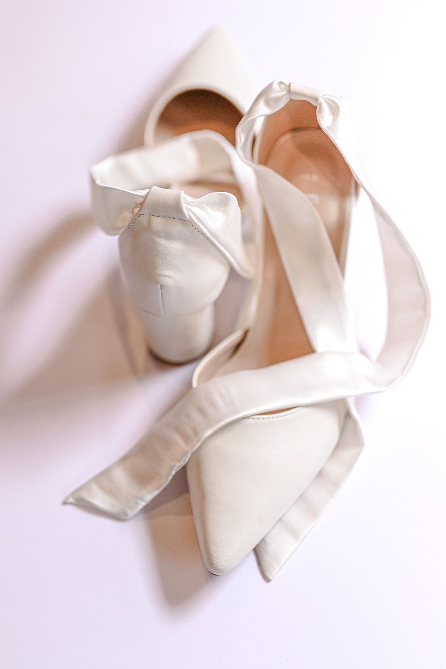 Ivory closed toe bridal block heel with satin strap to tie bow