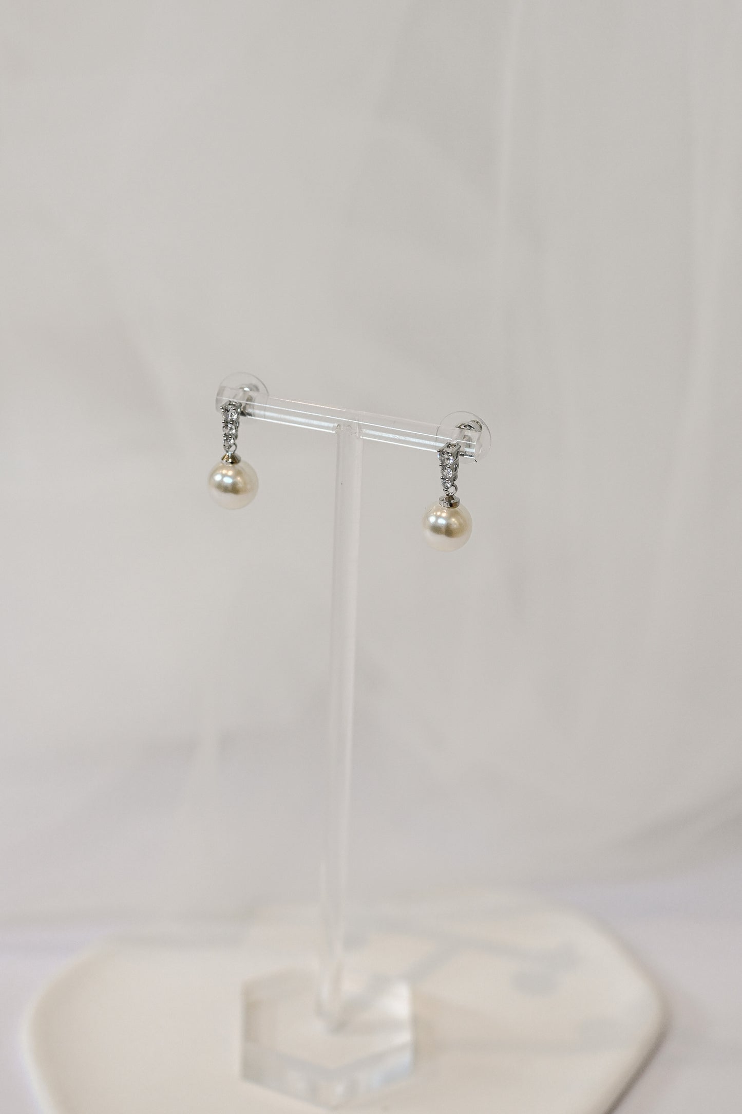 Silver bridal drop earrings with cubic zirconia and a faux pearl