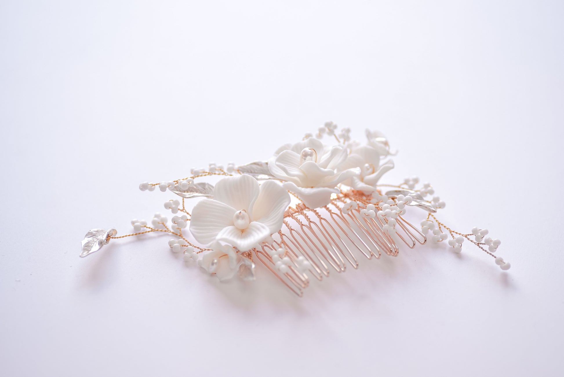 Rose gold bridal hair comb with porcelain flowers, fresh water pearls and beads