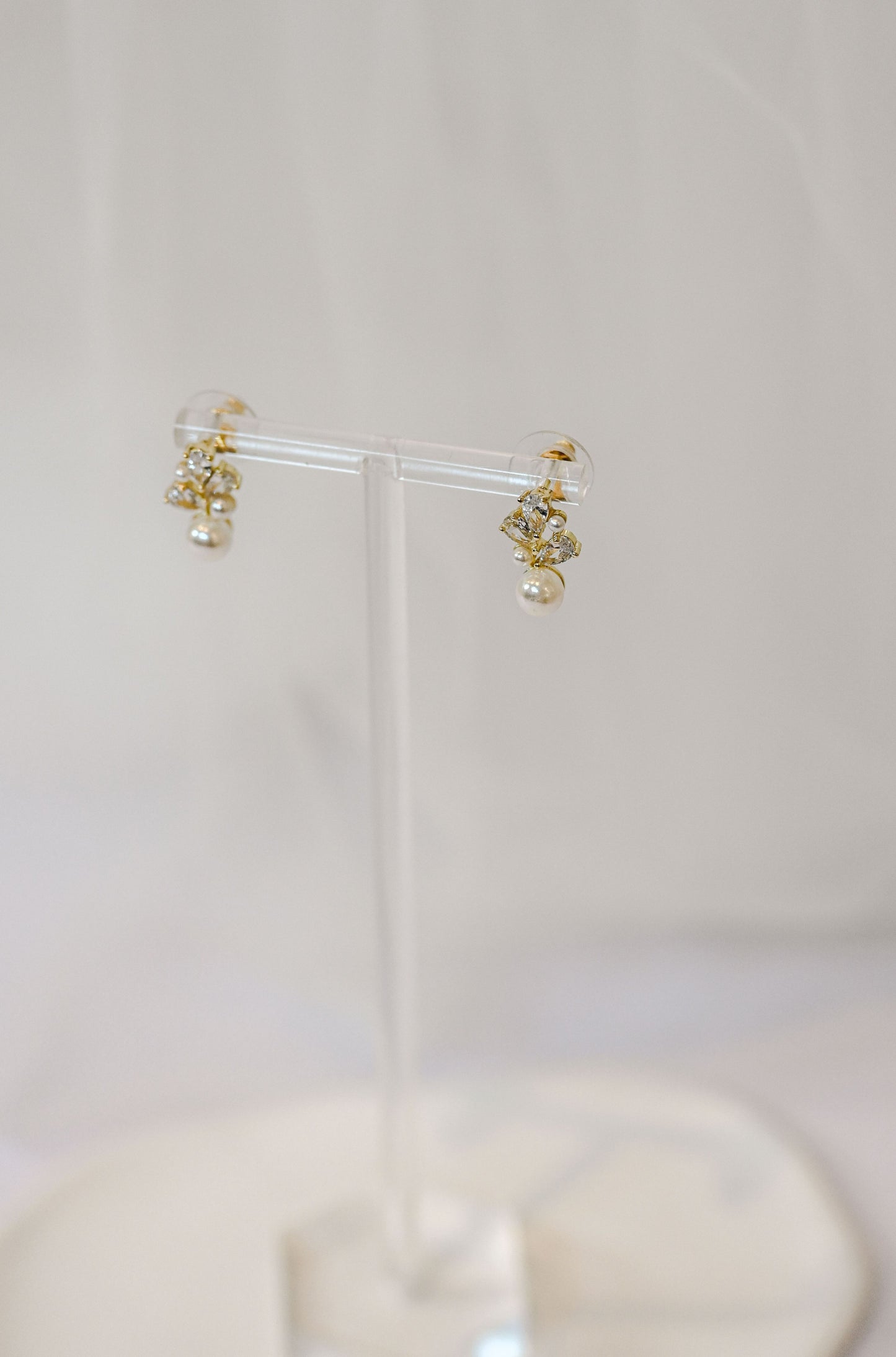Dainty gold bridal stud earring with cubic zirconia and pearls