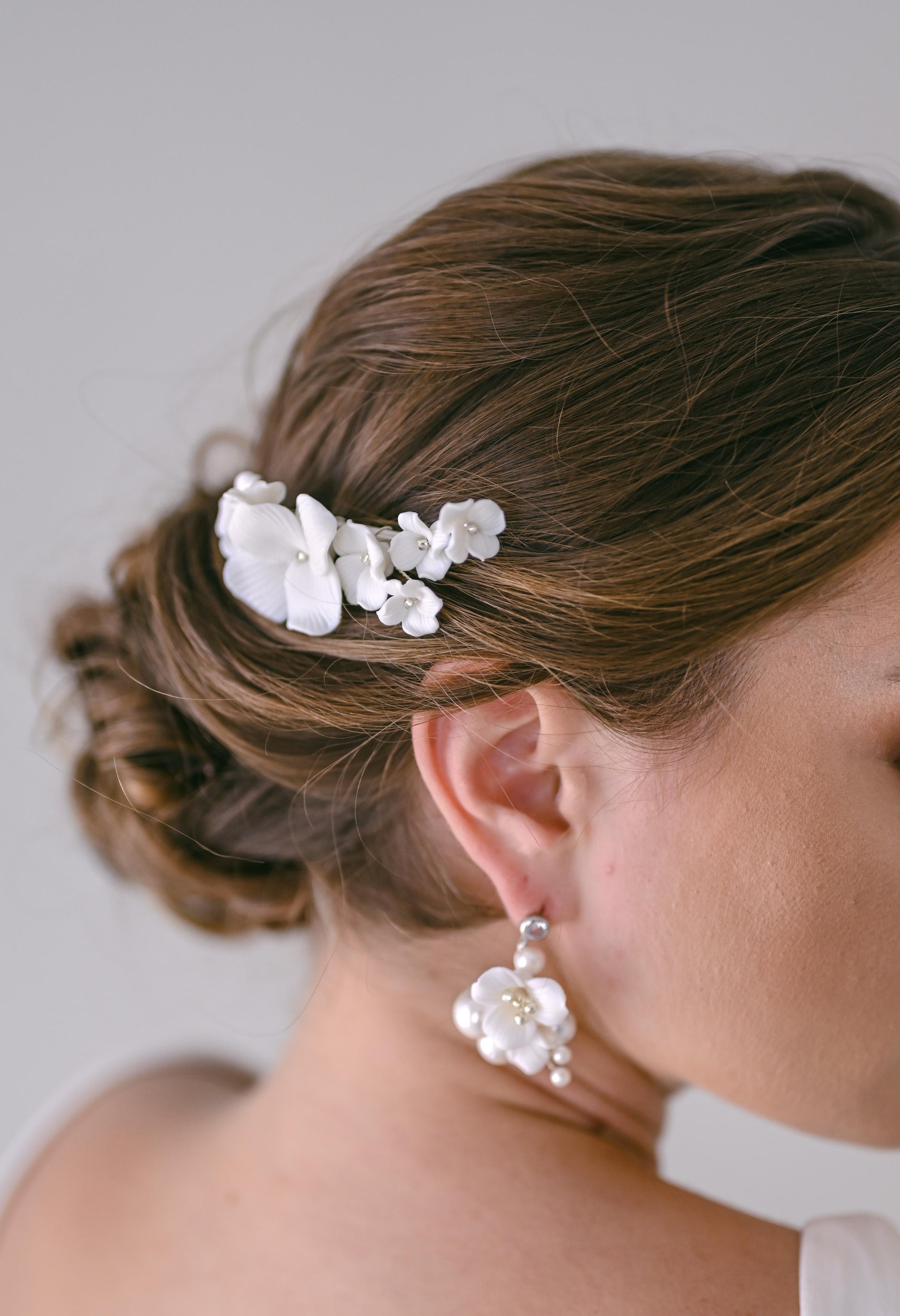 Bride wearing porcelain flower hair clip