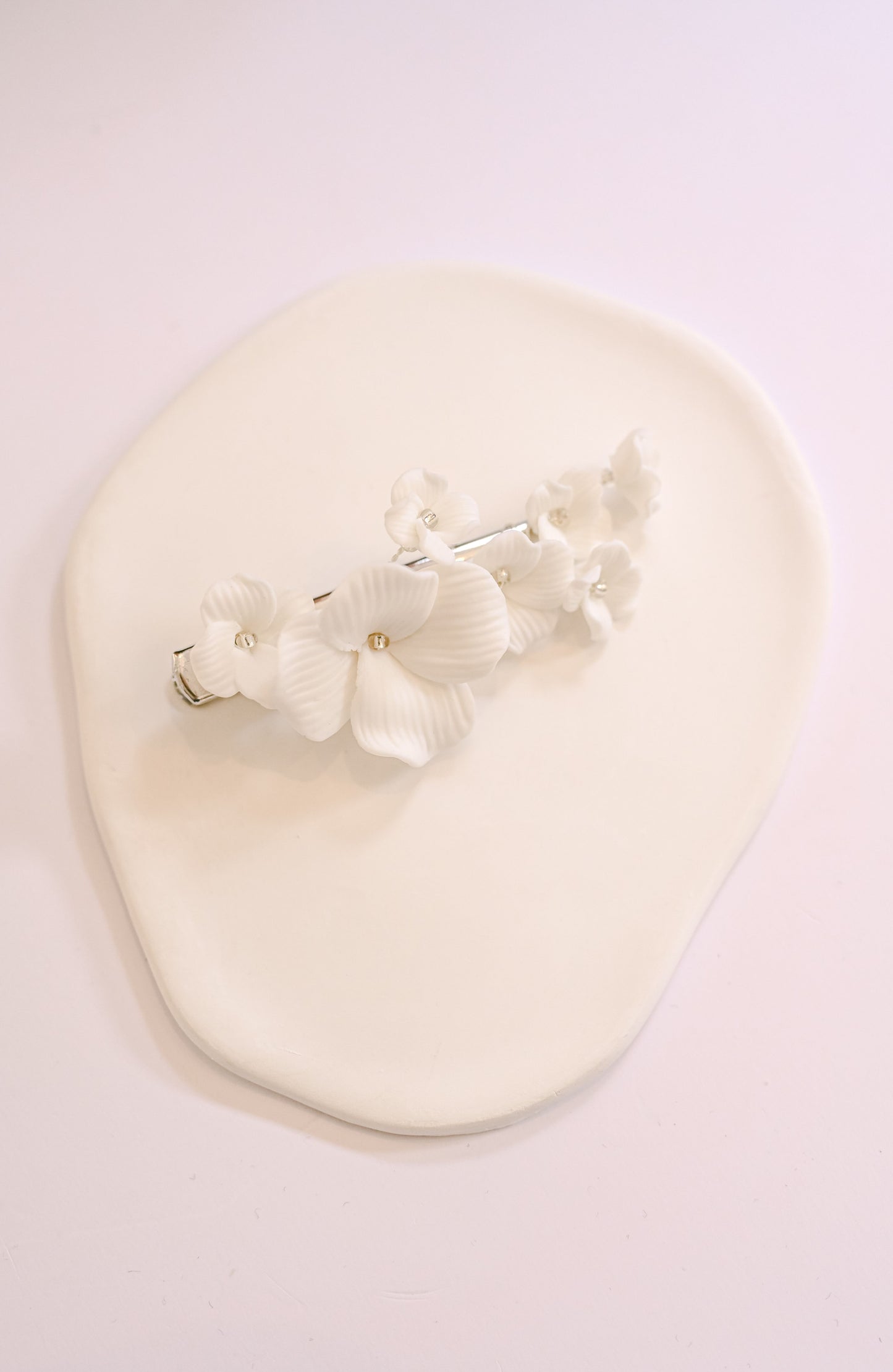 Bridal hair clip with porcelain flowers