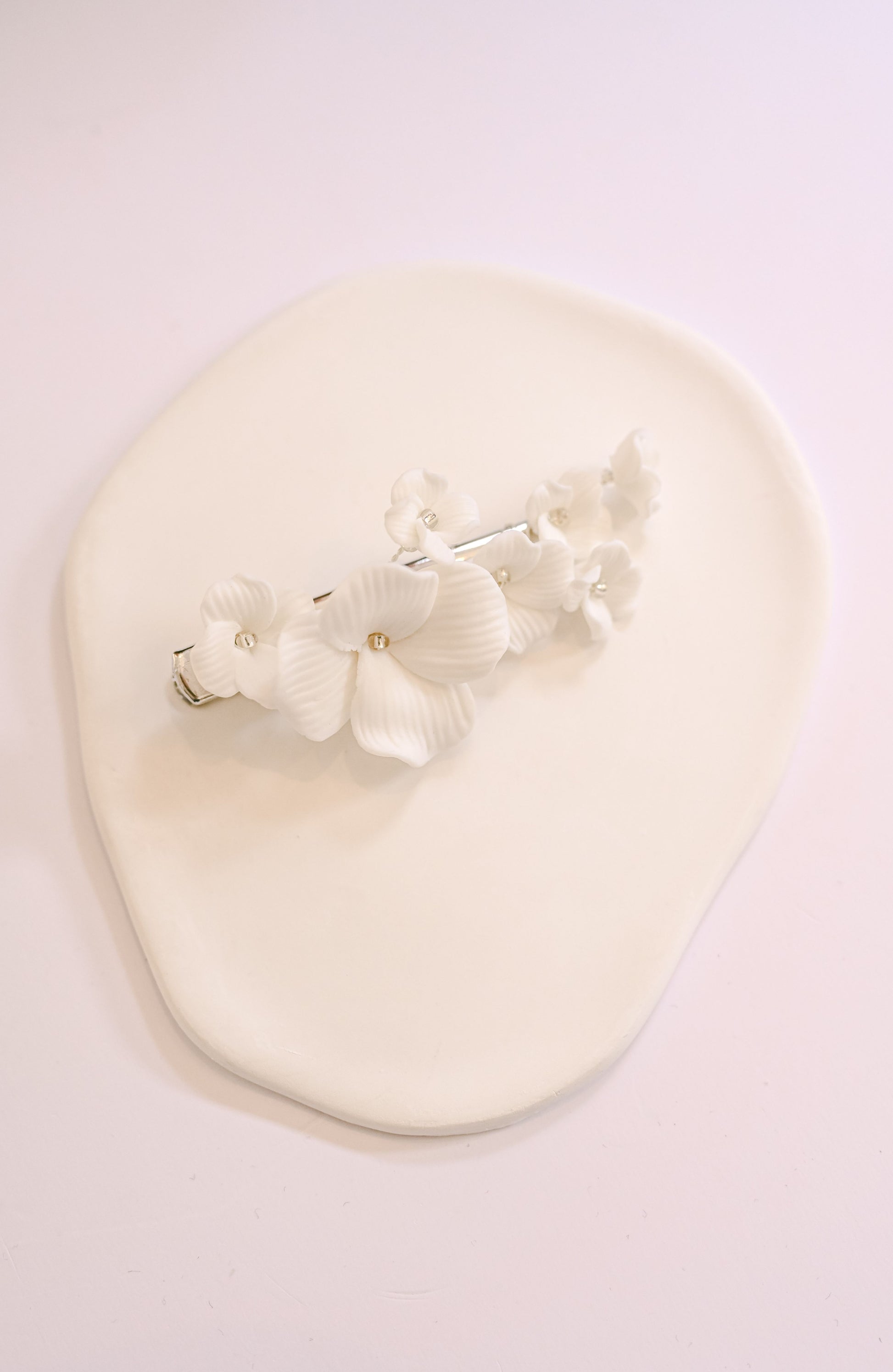 Bridal hair clip with porcelain flowers
