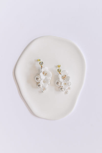 Gold bridal earring with porcelain flowers and pearls