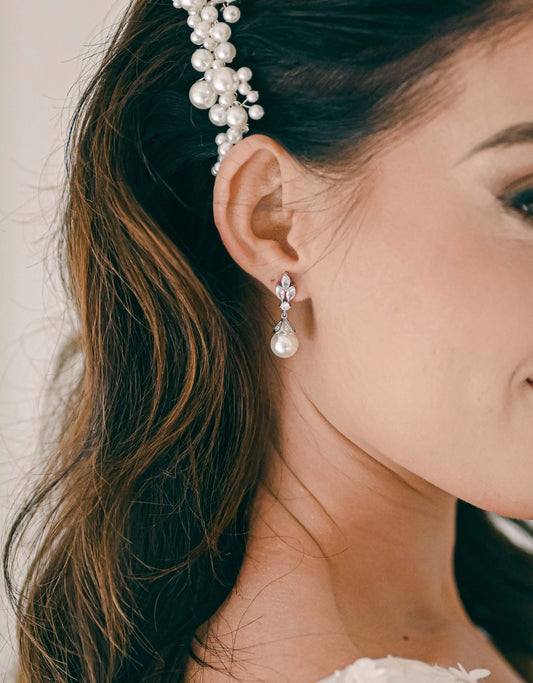 Bride wearing Cubic Zirconia bridal drop earrings with pearl detail.