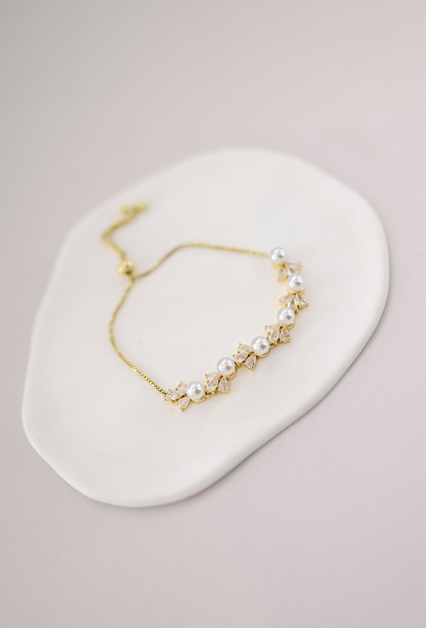 Adjustable gold bridal bracelet with pearls and cubic zirconia