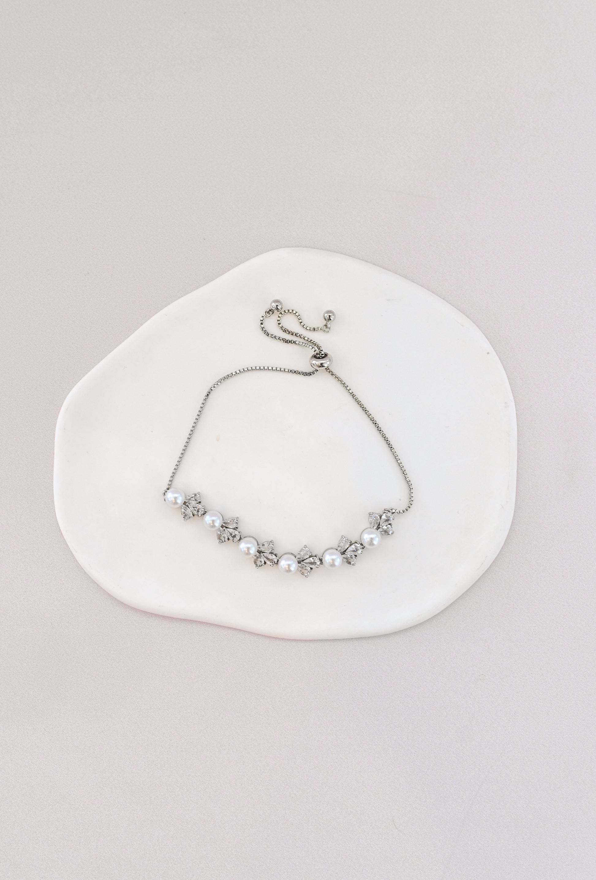 Adjustable silver bridal bracelet with pearls and cubic zirconia