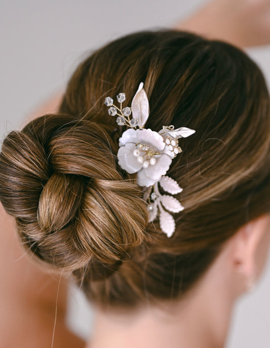 Bride wearing rose gold floral hair comb