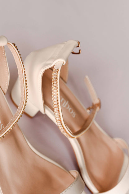 Ivory bridal block heel with open toe design and gold embellished ankle strap