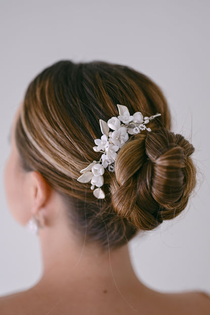 Bride wearing porcelain flower hair comb