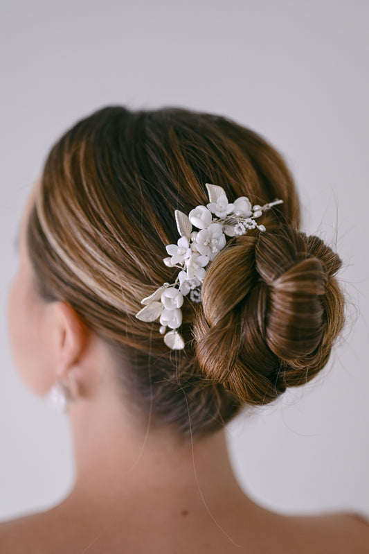 Bride wearing porcelain flower hair comb