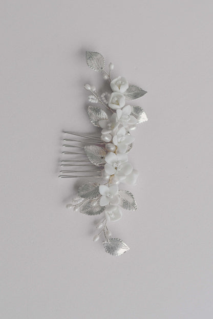 Silver bridal hair comb with porcelain flowers, fresh water pearls and leaf details.