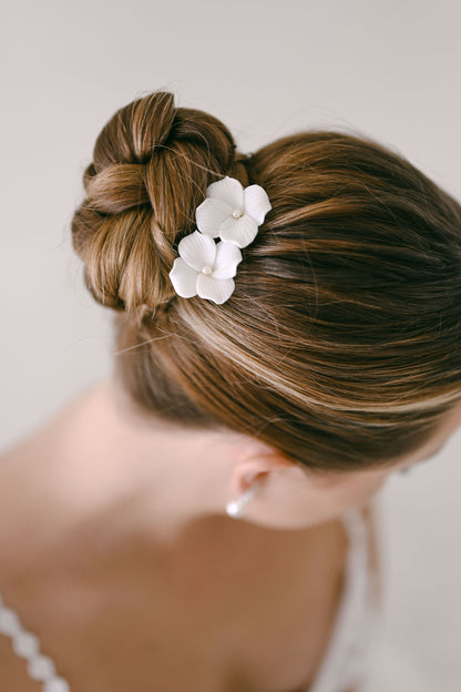 Bride wearing porcelain flower hair clip