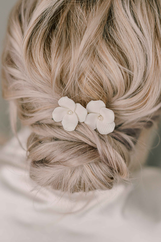 Bride wearing porcelain flower hair clip