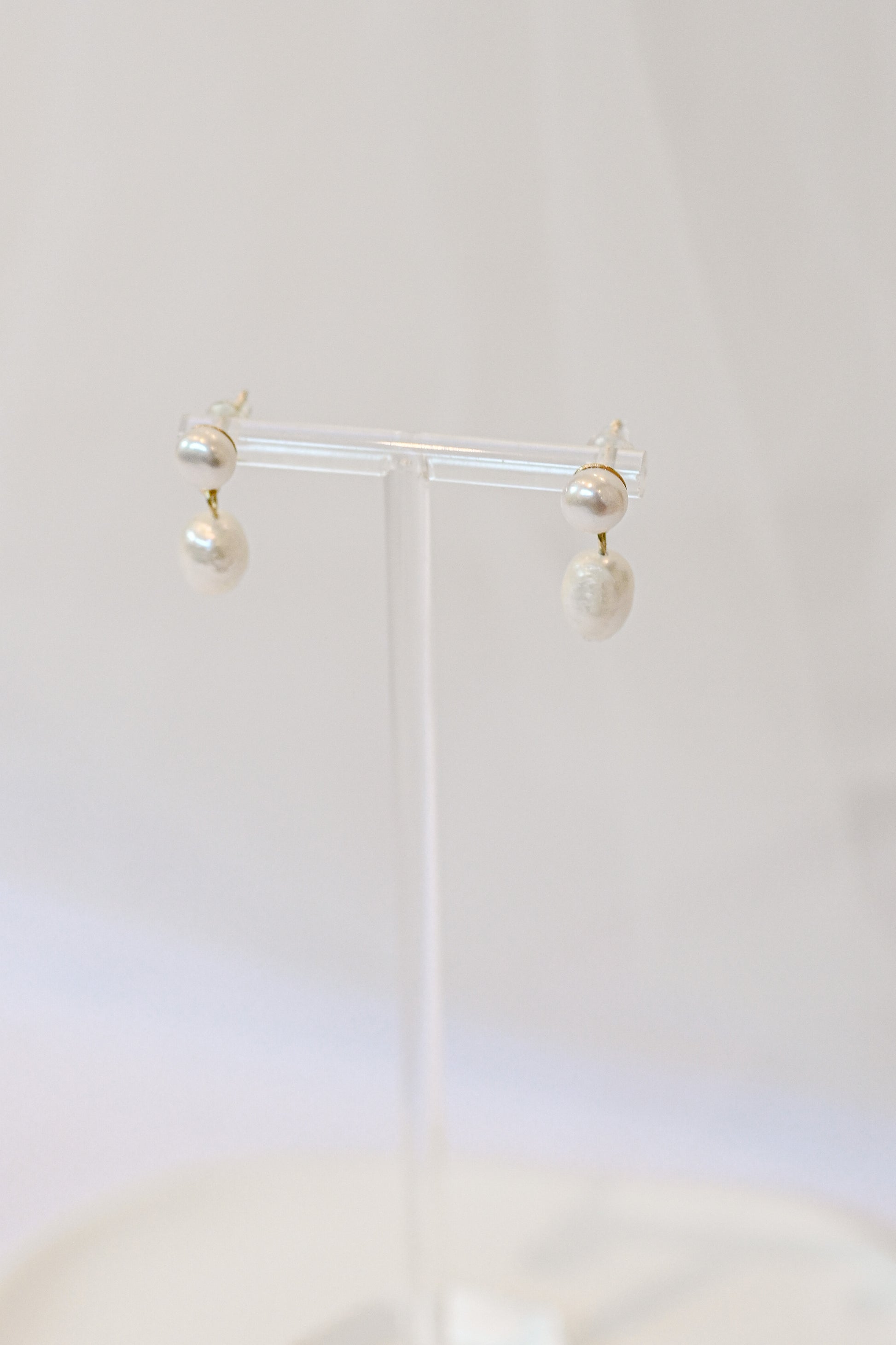 Pair of gold bridal earrings with two small faux pearls