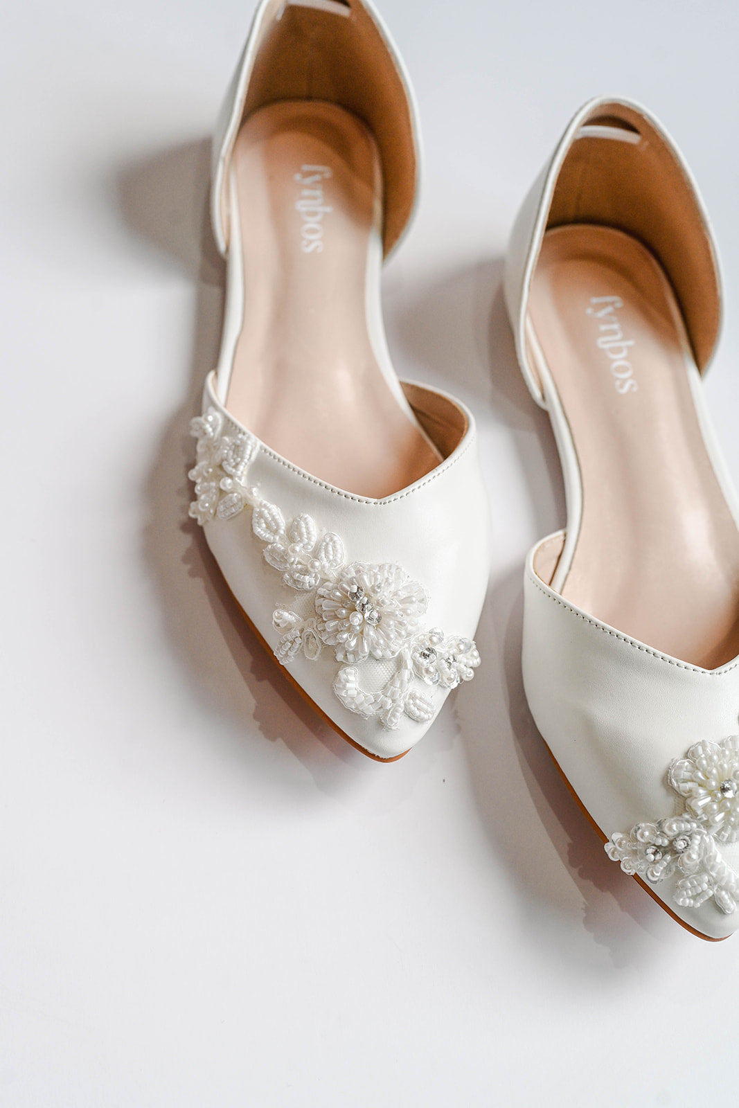 Ivory bridal flats with beaded lace decoration
