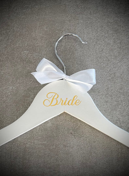 White wooden hanger with gold Bride vinyl and a white ribbon bow